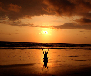 A Lady Doing Yoga Next to a River