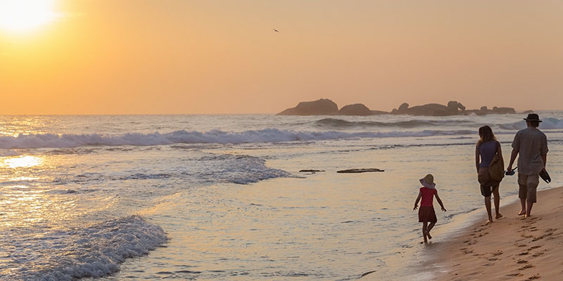 Family Walking by the Beach